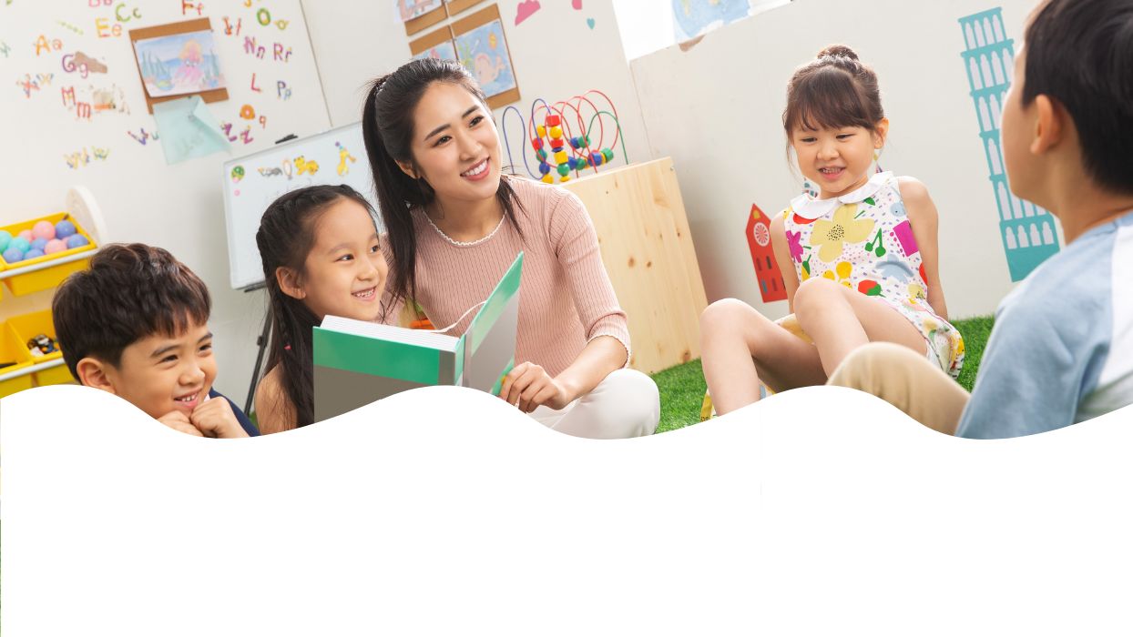 Teacher reading to a group of children in a classroom setting