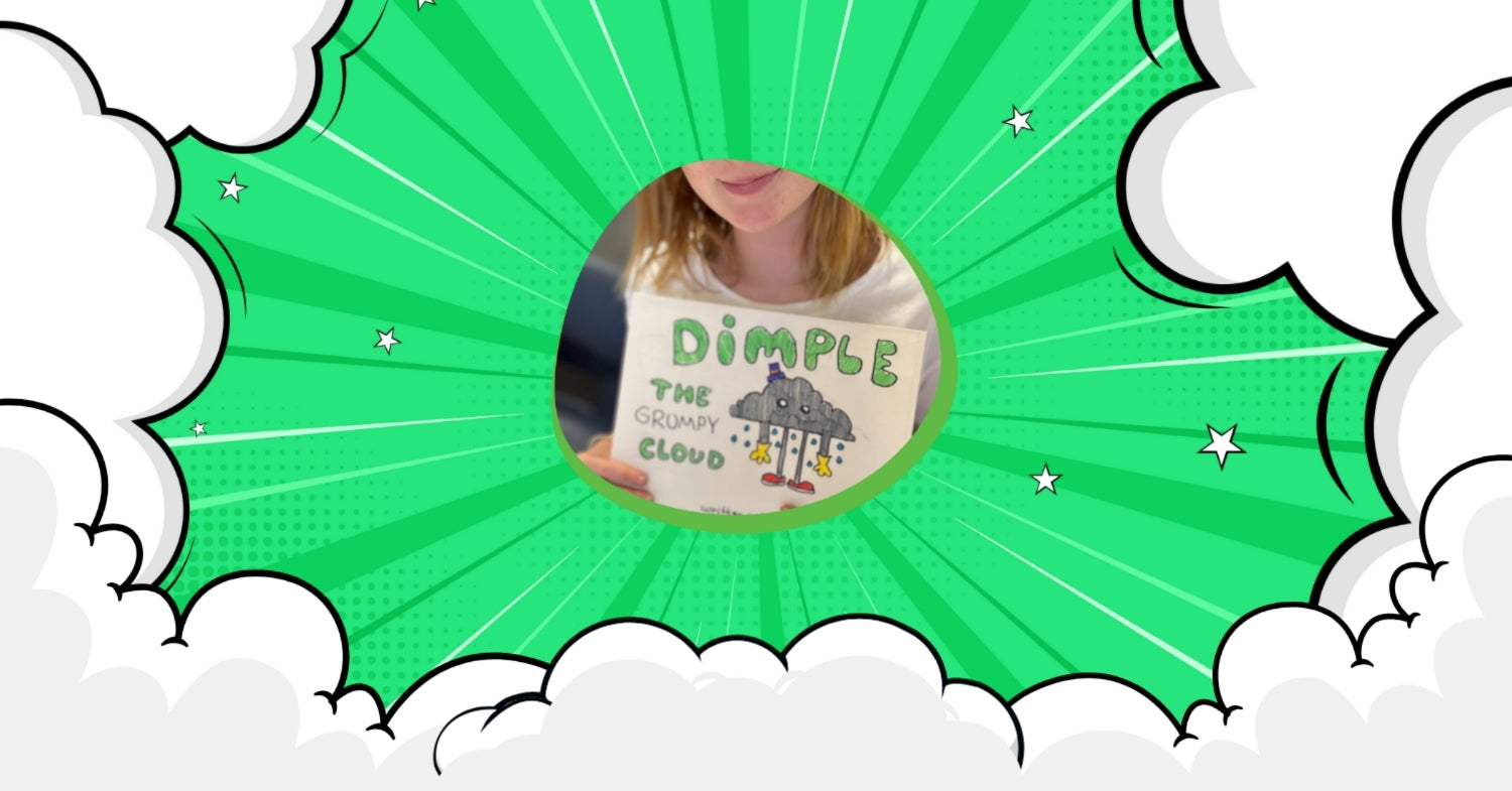 child holding her own book she created